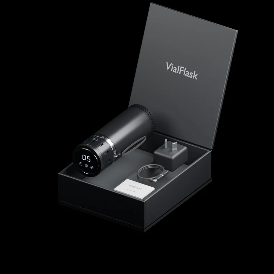An open black VialFlask box with the VialFlask Pro cooler, mains adaptor, coiled USB-C cable and quick-start guide lifted from their compartments.